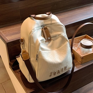 Sac à dos polyvalent en cuir PU blanc et marron avec poche à damier sur escalier