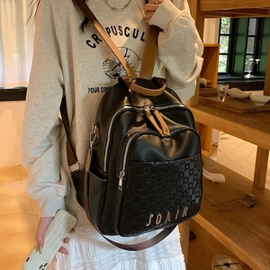 Sac à dos femme en similicuir noir avec détails à carreaux et bretelles marron