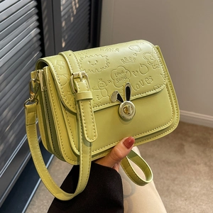 Green leather crossbody flap bag with cartoon embossed patterns and rabbit ear metal lock