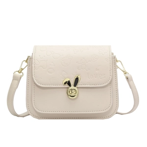 Elegant cream white children's crossbody bag with gold bunny ear lock and cartoon embossing
