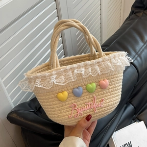 Handwoven beige summer tote bag with lace trim and colorful heart embroidery