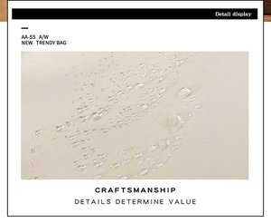 Detail shot of premium water-resistant cream fabric with clear moisture droplets