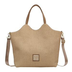 Sac fourre-tout en paille tressée beige avec bordure en cuir et bandoulière réglable