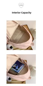 Interior view of the pink backpack showing a spacious main compartment and inner pocket