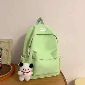 Women's Waterproof Nylon Backpack Large Capacity Casual Travel School Bag With Cute Plush Pendant Solid Color Backpack