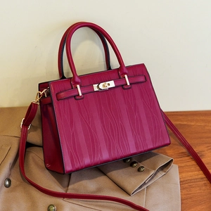 Elegant dark red wave texture handbag with gold clasp and detachable shoulder strap