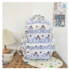 Détail d'un sac à dos en toile blanche avec illustration de chien bleu et motifs