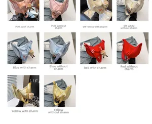Detail view of large nylon dumpling bags in five colors with optional plush charms