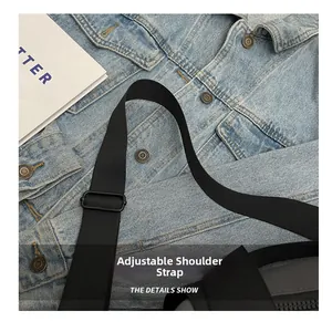 Detail of adjustable woven nylon shoulder strap on the waterproof travel bag