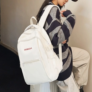 Minimalist white nylon backpack with red lettering for women in casual student style