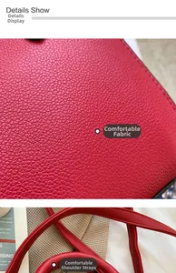 Detailed close-up of red lychee grain leather texture and quality stitching on the strap