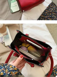 Detail showing the large interior capacity of this red bridal handbag with zipper