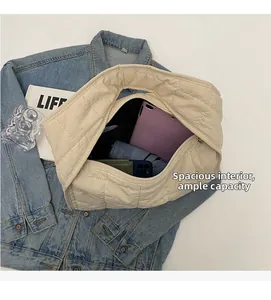 Top view of quilted canvas tote bag showing interior space for tablet and umbrella