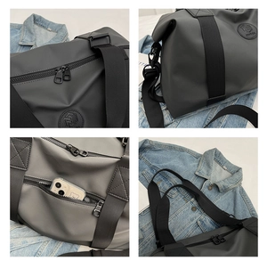Detail of waterproof Oxford travel bag showing smooth zippers and side phone pocket