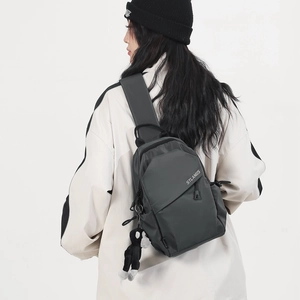 Dark grey large capacity crossbody chest bag with STLANGS logo and monkey charm