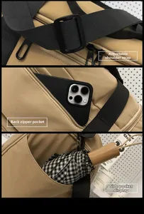 Detail view of khaki nylon travel bag with adjustable strap and anti-theft zipper pocket