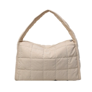 Beige quilted tote bag with padded cloud texture and white contrast stitching detail