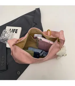 Interior view showing the large storage capacity of the pink suede hobo shoulder bag