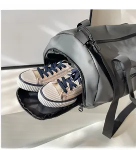 Macro shot of a grey travel bag showing a dedicated side compartment for shoes