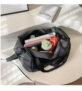 Top view of spacious grey travel bag interior showing large capacity for essentials