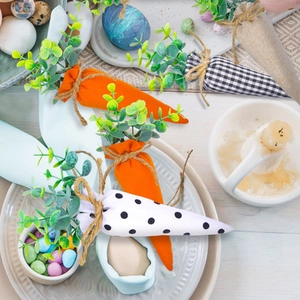 Detail of fabric Easter carrots with checkered and polka dot prints on a festive table