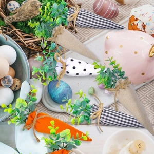Detail of fabric Easter carrots featuring plaid and polka dot patterns for rustic decoration