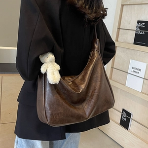 Vintage brown large tote bag in oil wax texture with bear charm for women's daily commute