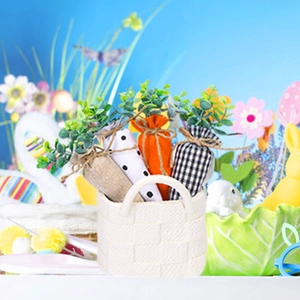 Set of four fabric Easter carrots with spotted and plaid patterns in a small woven basket