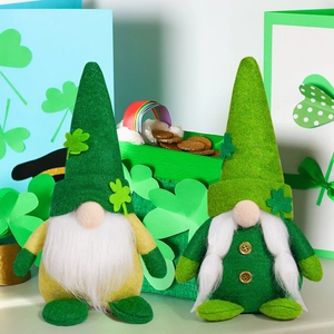 Detail of St. Patrick's Day gnomes with green shamrock hats and gold coin props