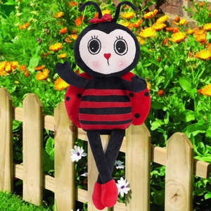 Detail of cute long-legged ladybug plush doll with striped body and heart-shaped nose