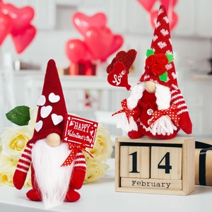 Close-up of Valentine's Day gnomes featuring Love signs and knitted heart patterns