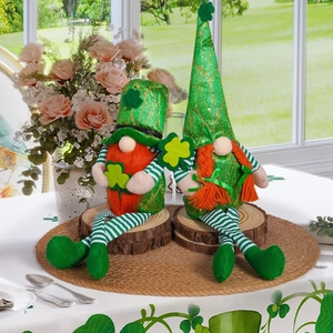 Pair of St. Patrick's Day gnomes with green sequin hats and shamrock clover decorations
