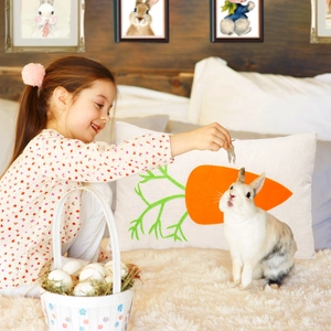 Close-up of linen carrot pillow case in a cozy Easter bedroom with a real bunny