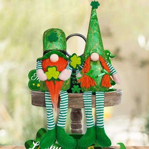 Pair of St. Patrick's Day gnomes with green sequin hats on a tiered wooden tray
