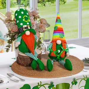 Detail of St. Patrick's Day gnomes with green hats and orange beards on a wooden base