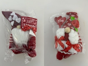 Detail of Valentine's Day gnomes with heart patterns and rose decor in packaging