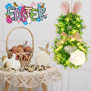 Détail d'une couronne de Pâques lumineuse avec verdure artificielle et oreilles de lapin