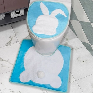 Blue Easter bathroom set featuring rabbit silhouette seat cover and matching floor mat