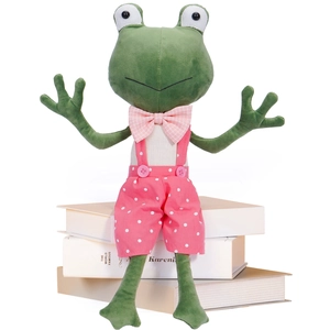 Cute long-legged frog plush toy wearing pink polka dot overalls on books for home decor