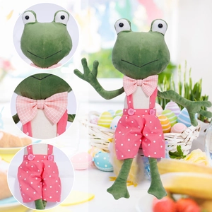 Cute green frog plush toy wearing pink plaid bow tie and polka dot overalls for holiday