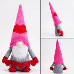 Three-sided view of a pink Valentine gnome with knitted heart hat and white beard