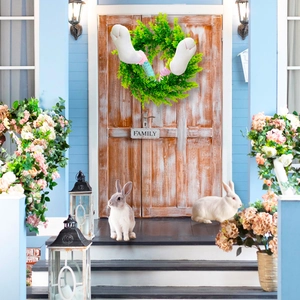 Easter wreath featuring colorful plush bunny legs and green plants with Family sign