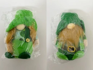 Close-up of St. Patrick's Day green gnomes with felt hats and golden belt buckles