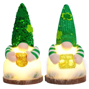 Lighted St. Patrick's Day gnomes with green sequins and gold coins on wooden bases