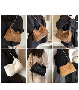 Three colors of Hobo shoulder bags with metal chain straps shown on a model from various angles