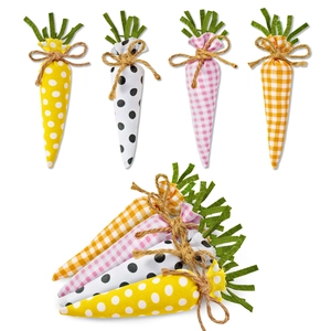 Close-up of Easter cloth carrots with polka dots and plaid patterns with burlap bows