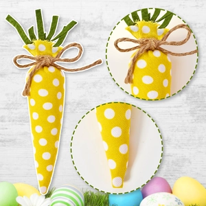 Detail of fabric Easter carrot with white polka dots, green felt leaves and jute twine bow