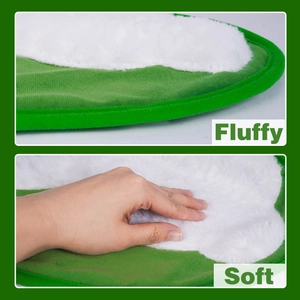 Detailed macro view showing the thick white fluffy plush texture and soft green fabric edge