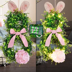 Detail of LED Easter bunny wreath showing light effect and battery compartment