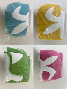 Detail of colorful plush toilet covers featuring rabbit head silhouettes in packaging